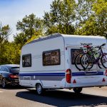 Caravan trailer on a freeway road.