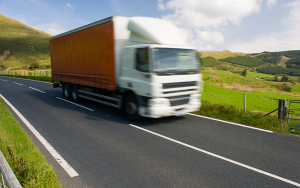 Lorry with a trailer driving on a country road